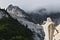 Marble quarries in Colonnata and monument to the quarryman.  The town is famous for the lardo di Colonnata and for the extraction