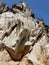 A marble rock standing tall in the blue sky