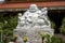 Marble sculpture of the happy Buddha with children in a Buddhist temple in the city of Danang, Vietnam