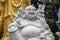 Marble sculpture of the happy Buddha with children in a Buddhist temple in the city of Danang, Vietnam