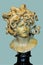 Marble sculpture of Medusa, the female monstrous creature having venomous snakes on place of her hair.