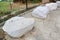 Marble seat in park. Natural stone chair in the garden