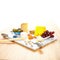 Marble serving dish with assortment of appetizers.