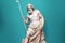 Marble statue of an ancient Greek god Zeus playing golf. Sculpture holding a golf club. Beauty standards, leasure, ideal body,