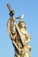 Marble statue of an Angel, in Rome, with cross and seagull