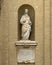 Marble statue of Saint Clare of Assisi on the right front of the Basilica of Saint Mary of the Angels in Assisi, italy.