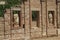 Marble statues in a brick wall of Roman Forum building in Merida