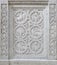 Marble stone carving with geometric, plant and bird motifs. Handmade. marble texture.