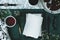 Marble table with green cloth in top view photo with glasses, tea cup, watch, blank paper and quill pen