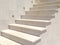 Marble white staircase lined light limestone stone