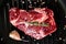 Marbled beef steak in a frying pan. Organic  farm meat. Black background