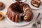 Marbled bundt cake sliced on a plate, chocolate and vanilla marble cake with chocolate glaze
