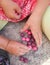 Marbles - little children hands playing pink and violet marbles