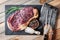 Marbling ribeye steak on wooden board