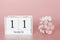 March 11th. Day 11 of month. Calendar cube on modern pink background, concept of bussines and an importent event
