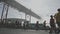 March 12, 2023 Lisbon, Portugal: people running EDP half marathon under the bridge in the fog