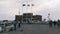 March, 16, 2019/Cyprus, Paphos. Musician playing the violin at pier. Beautiful Marina with castle and people walking along pier. L