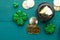 March 17, St. Patrick`s Day. Irish holiday, Flat lay green background with coins, clover. Old traditional festivals