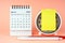 March 2024 Desk Calendar with alarm clock and adhesive note