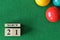 March 21, number cube with balls on snooker table, sport background.
