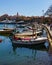 March 23, 2019 - Budva, Montenegro - Water taxis line the boardwalk near Old Town Budva, ready to take tourists to the surrounding