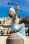 MARCH 24, 2018 - Washington DC, Female poses like Statue of Liberty in front of US Capitol,. Statue, Symbols