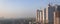 March 27, 2017 at Ghaziabad, India, Mechanical cranes in work on the buildings under construction and smog in air