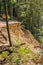 March 27, 2017 Los Gatos/CA/USA - People standing on the edge are discussing solutions regarding a collapsed paved road due to a