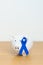 March Colorectal Cancer Awareness month, Navy Blue Ribbon with Piggy Bank for support illness life. Health, Donation, Charity,