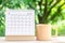 March month, Calendar desk 2022 for organizer to planning and reminder on wooden table with green nature background