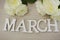 March month of spring wooden word on wood background top view