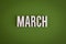 March sign lettering on green background