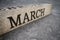 March text on grunge wooden block