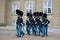 Marching Royal guards. The divorce of the guard at Amalienborg Palace. Copenhagen