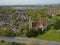 Marchwood village church in the spring aerial towards solar farm and Southampton Docks