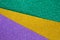 Mardi gras festive traditional color background. Abstract shiny background gold, green, purple. Glow glitter Mardi gras