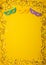 Mardi Gras gold color beads with Masquerade festival carnival masks and golden, green, purple confetti on yellow background