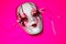 Mardi Gras Mask on pink background.