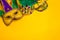 Mardi Gras Masks on yellow Background