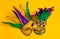 Mardi Gras Masks on yellow Background