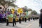 mardi gras parade with floats, dancers and marching band