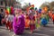 mardi gras parade, with people in colorful costumes and masks dancing and marching along the street