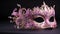 mardi gras pink carnival mask on dark background