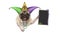 Mardi gras pug puppy dog with carnival jester hat, venetian mask and blank blackboard sign, hanging on white banner