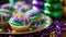 Mardi Gras Treats food and drinks in purple, green, yellow colors background. Masquerade festival carnival masks, gold