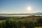 Maremma countryside panoramic view, olive trees, rolling hills and green fields. Sea on the horizon. Casale Marittimo