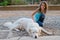 Maremma sheepdog resting lying on the ground