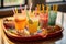 margarita garnishes and colorful straws on a tray
