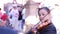 Mariachi woman playing a violin in the public square.