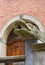 Mariacka street, grotesque gargoyle on front of tenement house, Gdansk, Poland